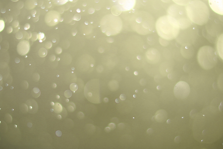 Beautiful bokeh and blurry on a gold background.の写真素材