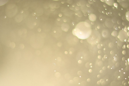 Beautiful bokeh and blurry on a gold background.の写真素材