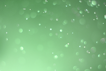 Beautiful and blurry bokeh on a green background.の写真素材