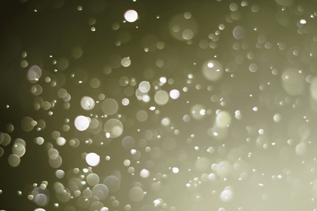 Beautiful bokeh and blurry on a gold background.の写真素材