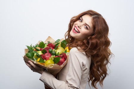 cheerful woman fun posing fruit bouquet vitamins Studio Modelの写真素材