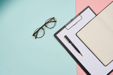 folder for papers office accessories notepad colorful background business toolsの写真素材