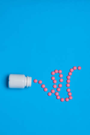 pain reliever vitamins capsules medicine blue backgroundの写真素材