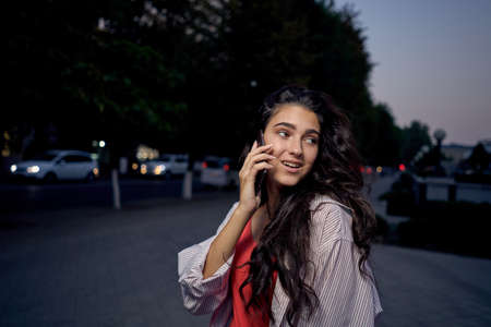 talking on the phone walking outdoors lifestyle fresh airの写真素材