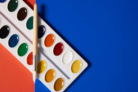 paints for artist drawing school learning art red backgroundの写真素材