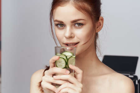 woman with bare shoulders cucumber health drink Freshの写真素材