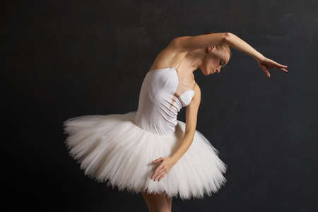 ballerina in a white tutu dance performance silhouette dark backgroundの写真素材