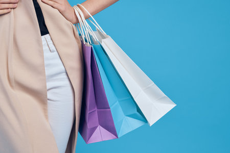 glamorous woman multicolored packs emotions shopping fashion studio modelの写真素材