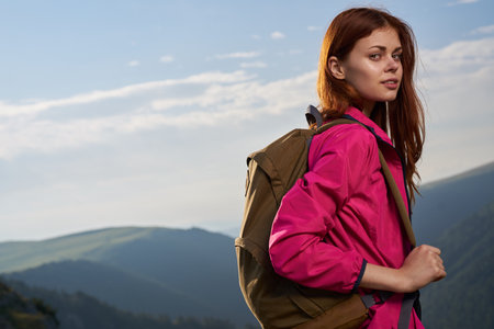 woman hiker outdoors in the mountains landscape fresh air