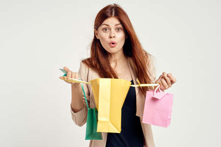 glamorous woman with packages in hands Shopaholic isolated backgroundの写真素材