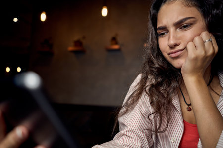 woman sitting in a cafe with a laptop coffee cup vacation