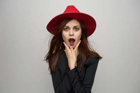 woman wearing metal witch costume red hat mystic holidayの写真素材