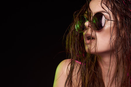 sexy woman wearing sunglasses posing luxury studio lifestyle