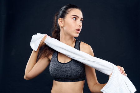 cheerful sports woman slim figure white towel in her hands