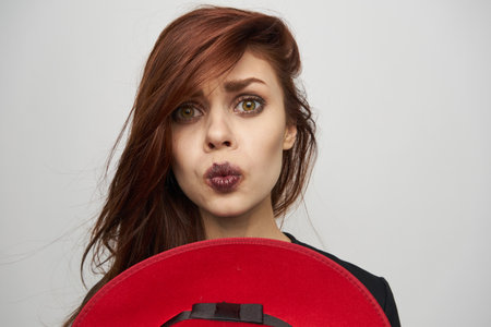 woman with red hat witch posing horror halloweenの写真素材