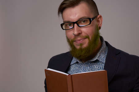 business man with a book in his hands job manager professionalsの写真素材