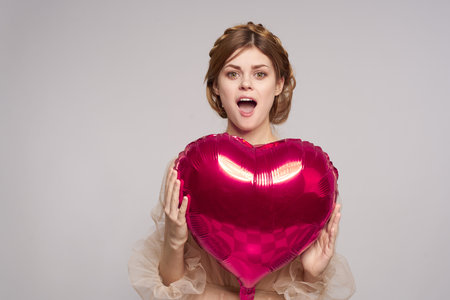 cheerful woman in a dress balloon Valentines Day isolated background