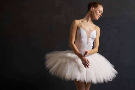 ballerina in a white tutu dance performance silhouette dark backgroundの写真素材