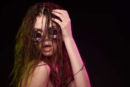 portrait of a woman attractive glance posing sunglasses studio lifestyleの写真素材