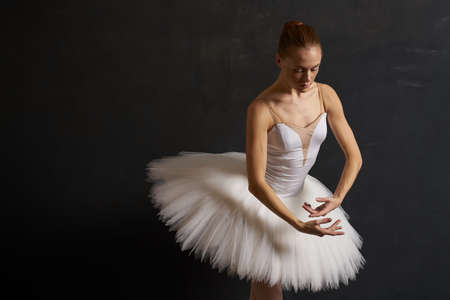 ballerina in a white tutu dance performance silhouette dark backgroundの写真素材