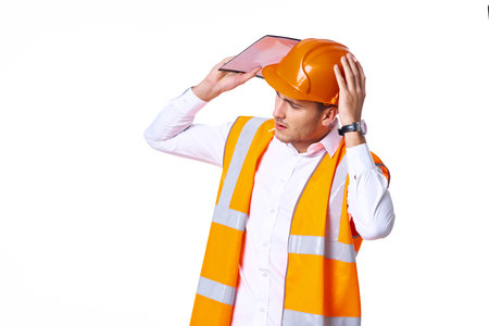 working man in orange uniform posing construction