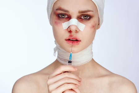emotional woman plastic surgery operation bare shoulders light background