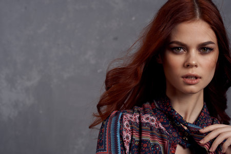 woman in coat fashionable clothes glamor red hair model