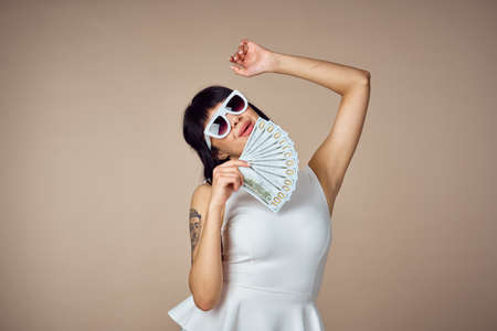 pretty woman in white dress fashion money luxury posingの写真素材