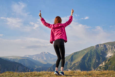 woman hiker outdoors in the mountains landscape fresh airの写真素材