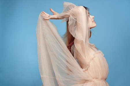 portrait of a woman attractive look lifestyle romance blue backgroundの写真素材