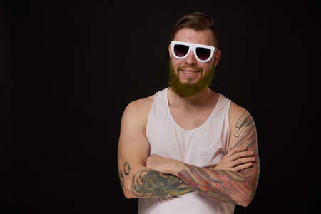 bearded macho man in white t-shirt sunglasses fashion tattoosの写真素材