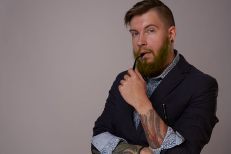 business man with glasses with tattoos on his arms office professionals