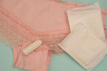 feminine pads underwear hygiene protection medicine blue backgroundの写真素材