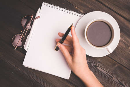 a cup of coffee notepad handle cafe the view from the topの写真素材