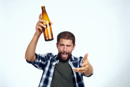 a man in a plaid shirt alcoholism problems emotions depression Lifestyleの写真素材