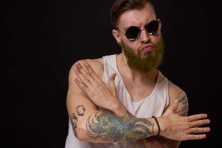 cheerful bearded man in white t-shirt sunglasses posingの写真素材