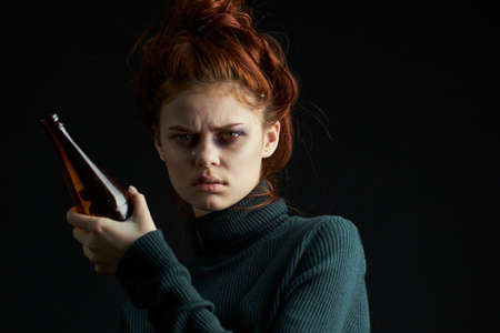 woman with cigarette bottle of alcohol bruises under eyes problems depressionの写真素材