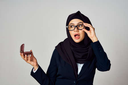 woman in black hijab laptop work technology officeの写真素材