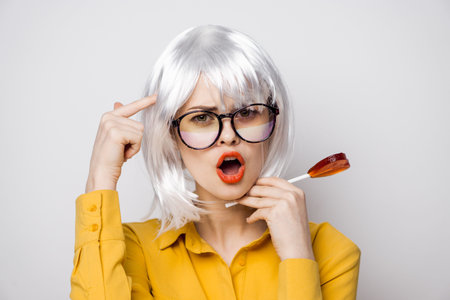 attractive woman with glasses white wig lollipop fashion glamor
