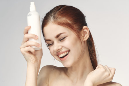 woman with lotion in hands clean skin care health close-up