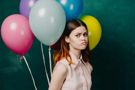 cheerful woman with colorful balloons birthday funの写真素材
