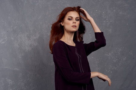 woman with red hair posing fashionable clothing elegant styleの写真素材