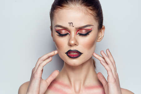 pretty woman naked shoulders cosmetics bright makeup color backgroundの写真素材