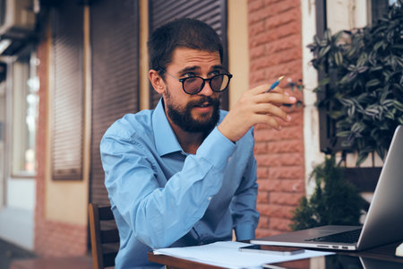 business man working on the street with laptop technology