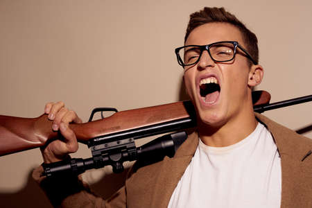 Man gun shooting killer mafia studio lifestyleの写真素材