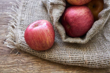 apples on a wooden table vitamins fresh fruits organicの写真素材
