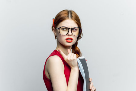 woman secretary in glasses with a notebook in the hands of the managerの写真素材