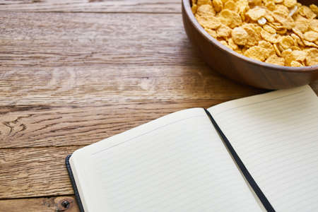 dry breakfast cereals notepad diet wooden backgroundの写真素材