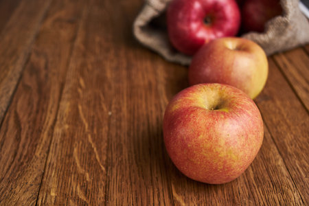 apples on a wooden table vitamins fresh fruits organic
