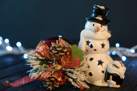 toy snowman christmas decoration garland holiday wooden backgroundの写真素材